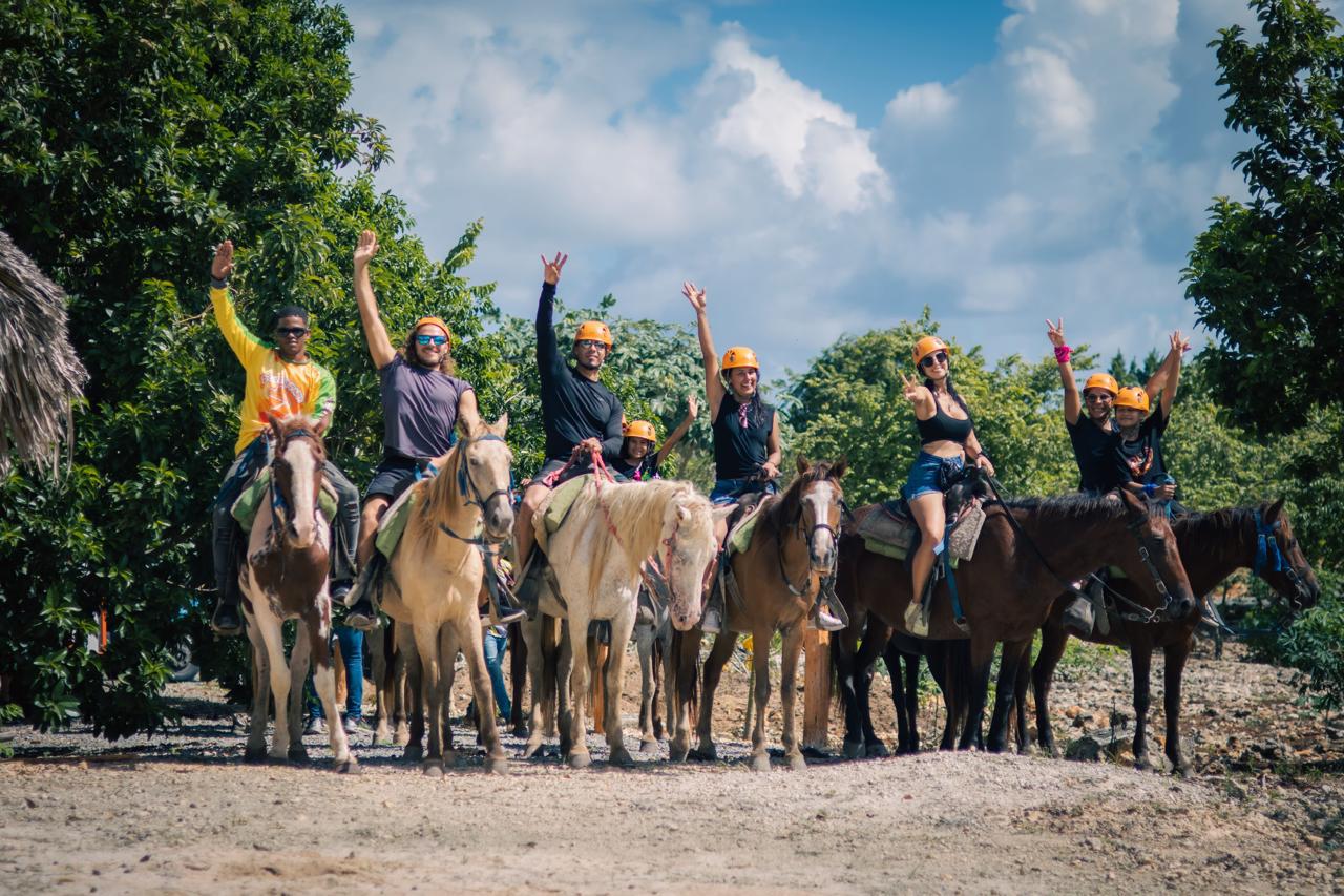 Group horseback ride through the countryside at Domitai Park